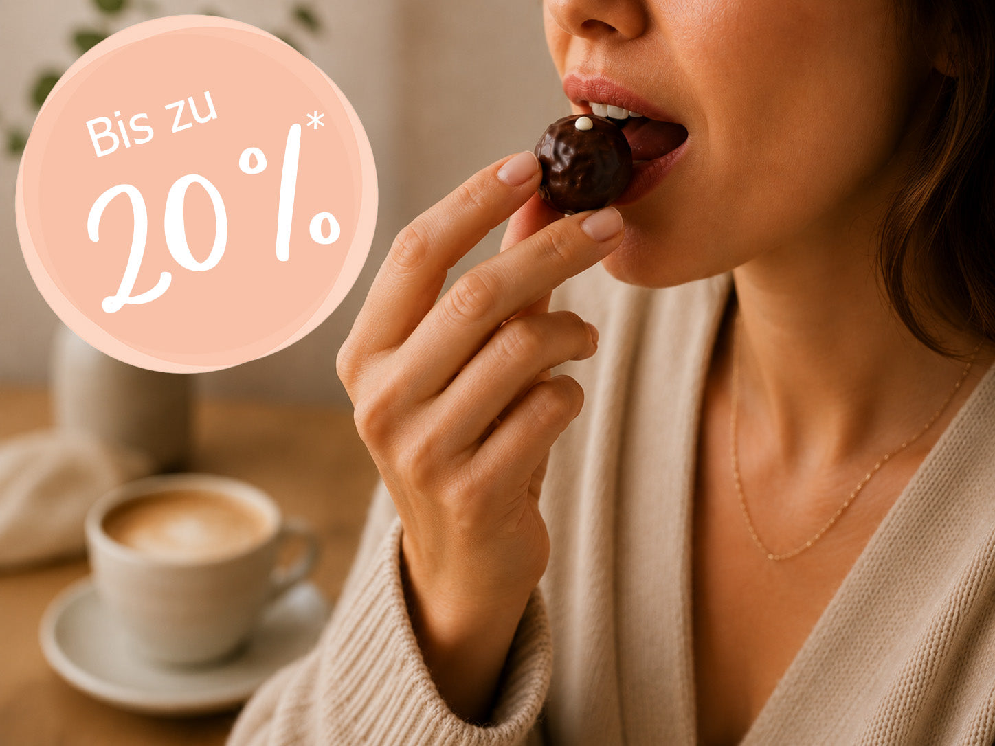 Eine Person ist gerade dabei, eine Praline zu essen. In der Ecke ist eine Bubble mit dem Text "Bis zu 20%" die auf den Rabatt aufmerksam macht.